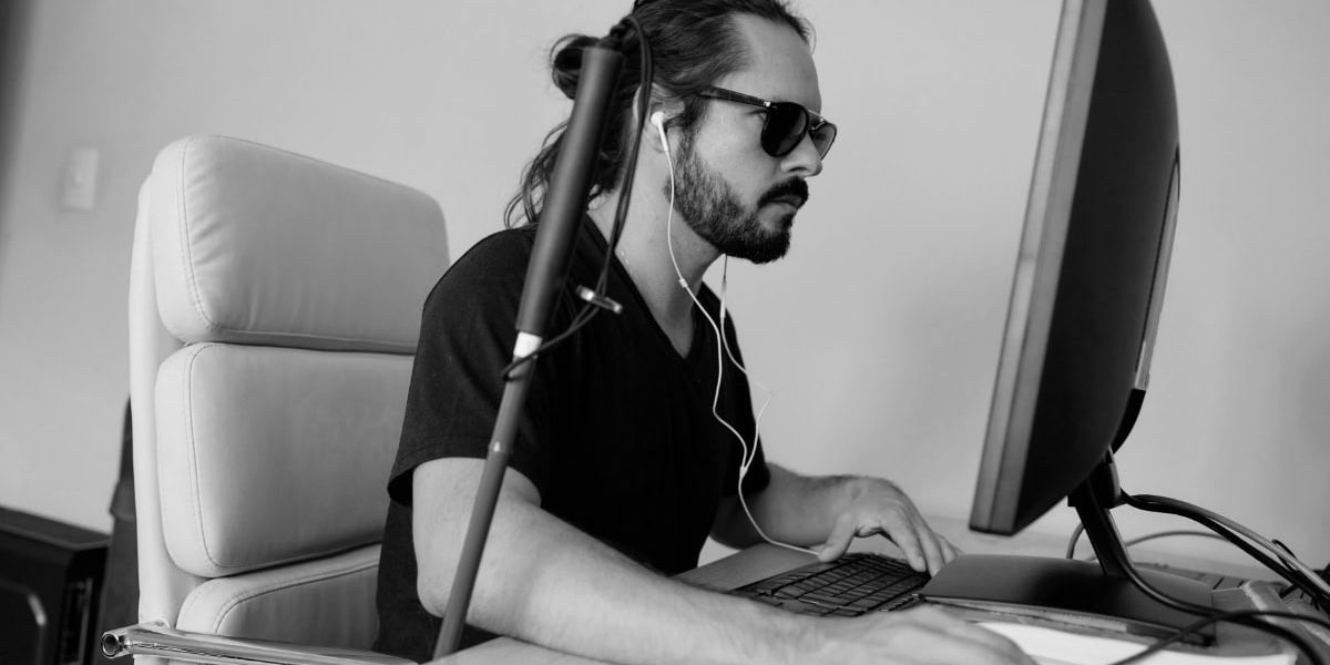 Blind Man Using Accessibility Tools On Website