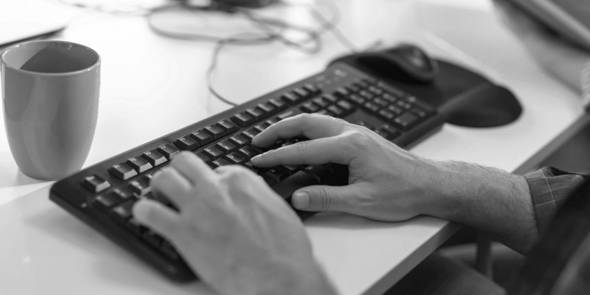 Man Typing On Keyboard