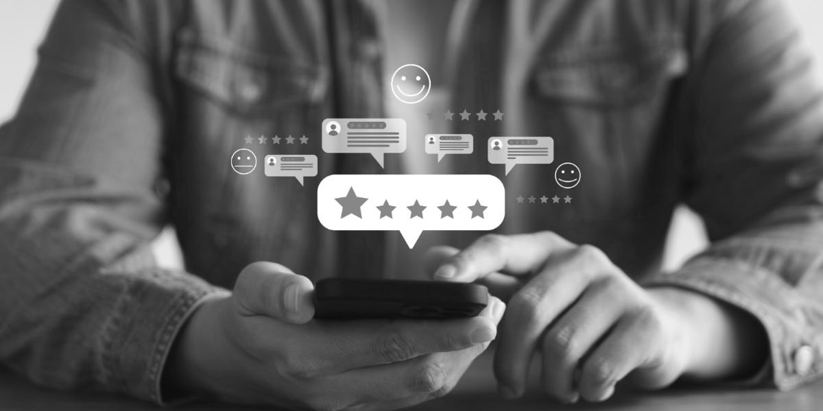 Man with phone leaving Google review