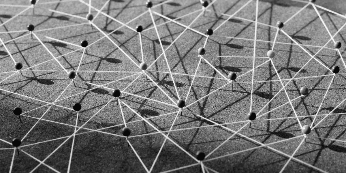 Pins And A Cork Board With Strings Connecting Them