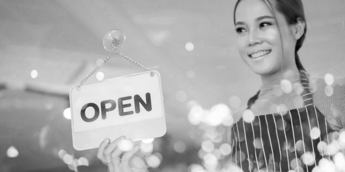 Woman Holding Open Sign