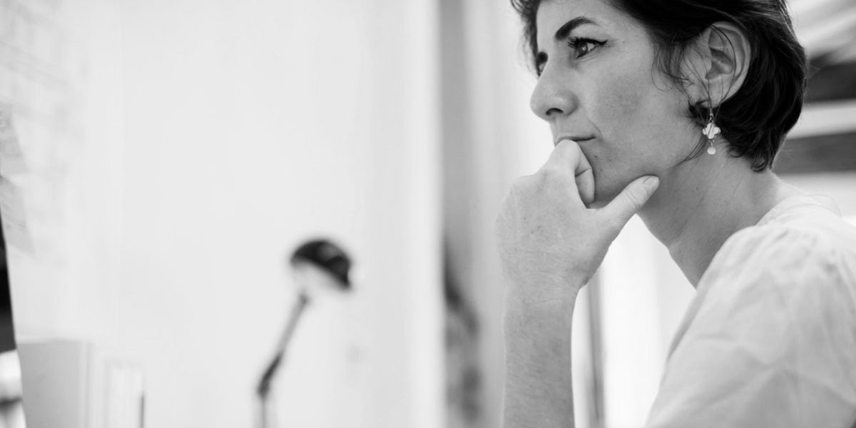 Woman In Deep Thought At Computer