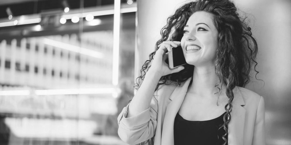 Woman On Cell Phone In Office